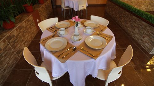 Cafe seating at a Patria hotel